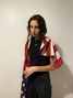 Portrait of American flag draped over shoulders