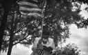 African American woman with American flag and Bible